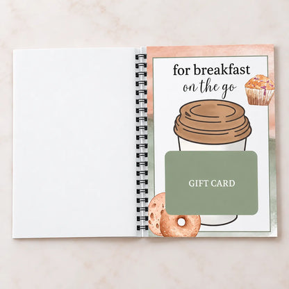 Open Christmas gift card book showing a themed page and space for a note
